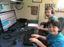 Team Thompsen: Mason (K7MWT) operates while his brother Tanner (K7TMT) logs.